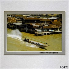 Long-Tail Boat Running Along a