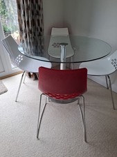 Calligaris Jam chairs and glass top table with chrome base
