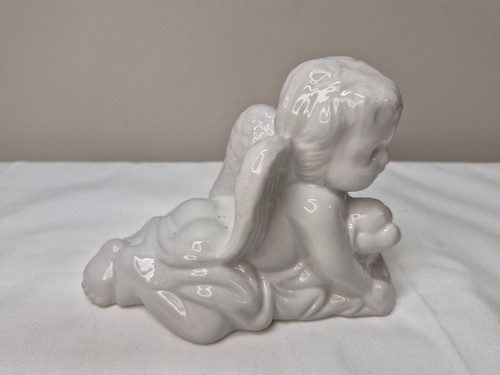 White ceramic angel figurine - white,