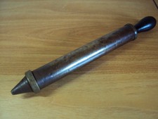 An Antique Brass Sliding Pump With A Wooden Handle Unknown Usage