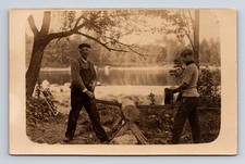 RPPC Two Man Saw Lake Cabin Building Construction? Gran Hiram Carrie Postcard
