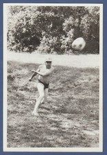 Shirtless guy playing football