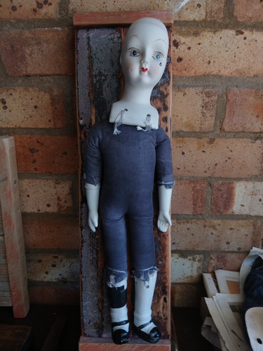 Antique doll mounted old - on, an