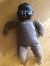 Antique black doll. Bakelite head fabric body very old
