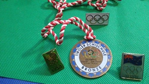 Four olympic themed pin badges - themed,