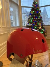 Red bobbin bike helmet for