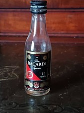 Miniature Alcohol Bottle - empty: Bacardi Rum.  Bottle has double label