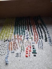 Assortment Of Plastic Miniature Soldiers And Accessories