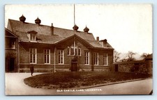 POSTCARD LEICESTER OLD CASTLE YARD MAN IN UNIFORM REAL PHOTO RPPC