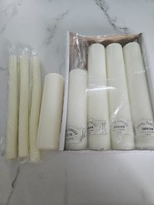 selection of pillar candles different burning time white in colour 