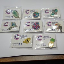 8X Cancer research UK pin