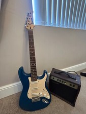 Marlin Blue Electric Guitar with Jim Harley amp. New strings
