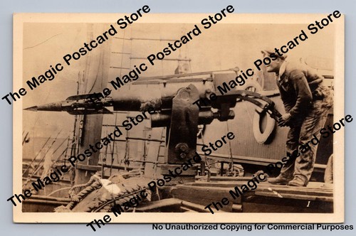 Boy aiming harpoon gun rppc - boy,