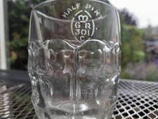 Vintage half pint pub or tavern glass with excise mark GR 301 stamped.