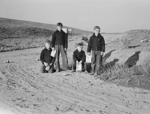 Boys wait for school - bus, in