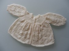NEW HAND KNITTED CREAM BABY