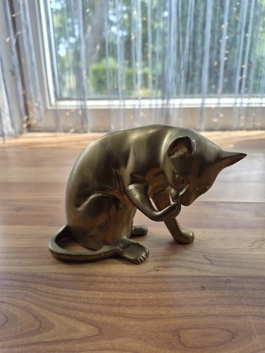 Vintage brass cat licking - vintage,