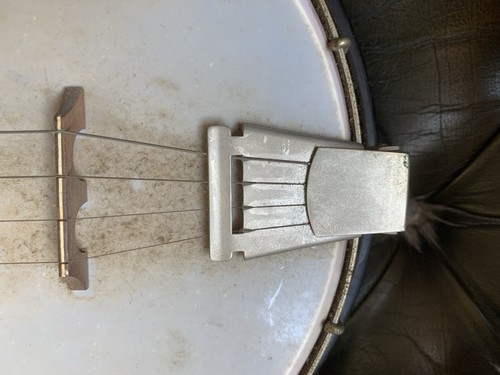 Well used string banjo - well, banjo.