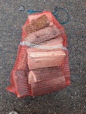 Seasoned Logs In Netting Chestnut