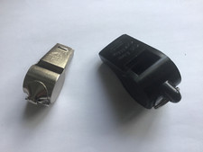 Hampion metal whistle (China) & The Acme Thunderer , cork pea, made in England .