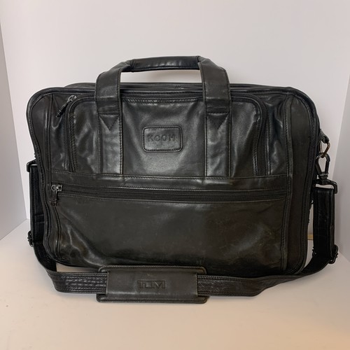 Tumi black leather - black,