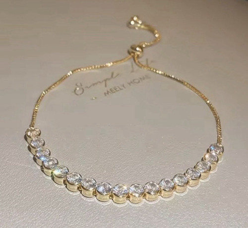 Gold tone adjustable bolo - tone,
