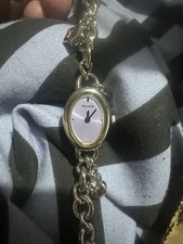 Accurist ladies' watch light purple dial and a silver chain bracelet with charms