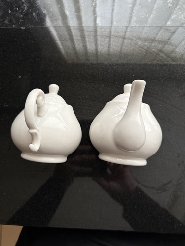 Wall mounted white teapots - wall,