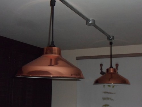 Two copper coloured pendant