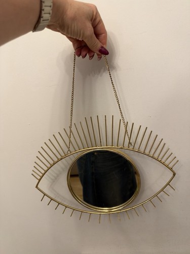 Gold metal eye shaped - eye, wall