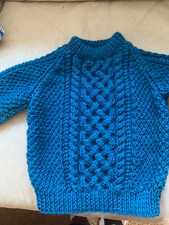 Hand knitted childs aran