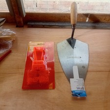 One Bricklaying Trowel,  2