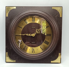 METAMEC WALL CLOCK QUARTZ. BATTERY OPERATED. SQUARE FAUX WOOD & BRASS DAMAGED