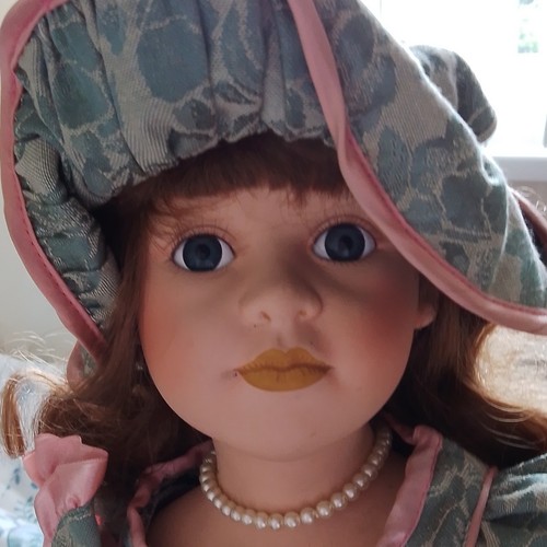 Porcelain girl doll brown - porcelain,