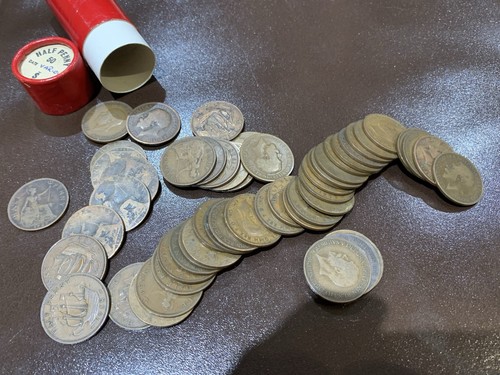 Half penny coins in - x,