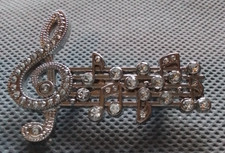 Vintage style notes brooch with stunning inset faux diamonds. New without tags.
