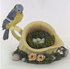 BIRD BLUE TIT ON A JUG NEST