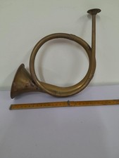 vintage or antique hunting horn, made of copper and brass.