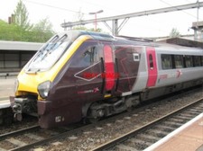 PHOTO  XC 221138 WITH A VIRGIN TRAINS RED CAB DOOR AT STAFFORD 21/06/11