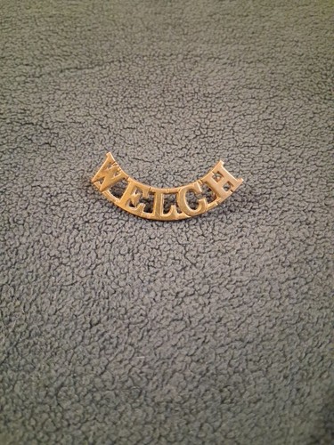 Welch shoulder title with lugs