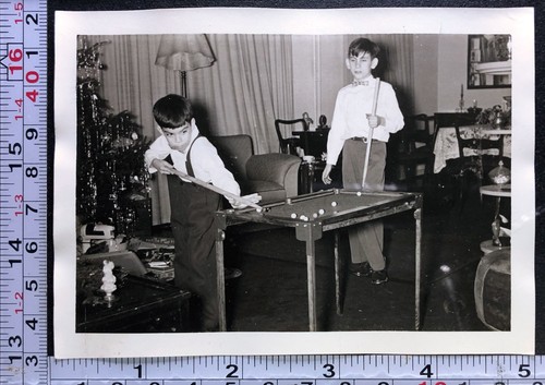 Two children shooting pool - two,