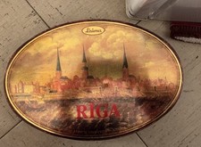 The tin features an artistic