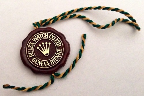 Rolex vintage red tag seal - red,