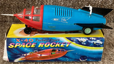 A v-good boxed plastic 1960's friction drive X40 Space Rocket & shooting capsule