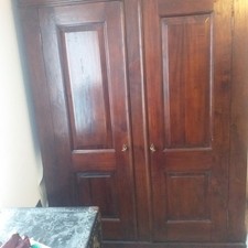 Polished teak Lombok wardrobe flat-packs for easy collection and assembly.