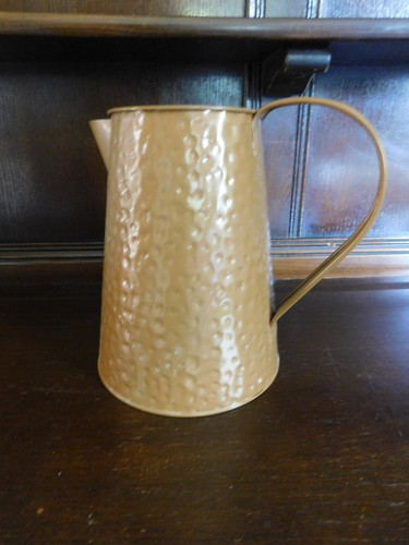 Brown hammered tin jug - hammered,