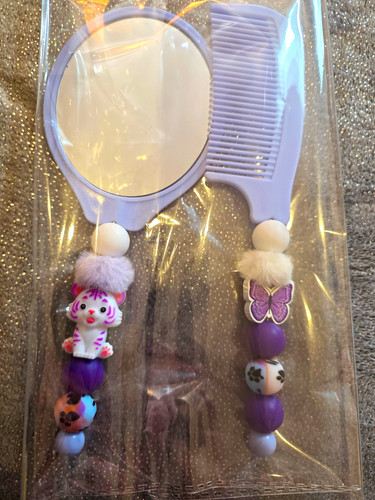 Hand held round mirror comb - held, &
