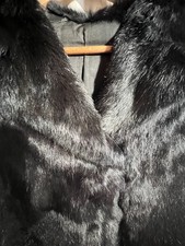 black sleeveless waistcoat