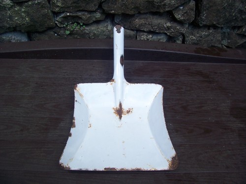 Old rusty enamel shovel - rusty,