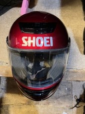 Red used shoei motorcycle helmet
